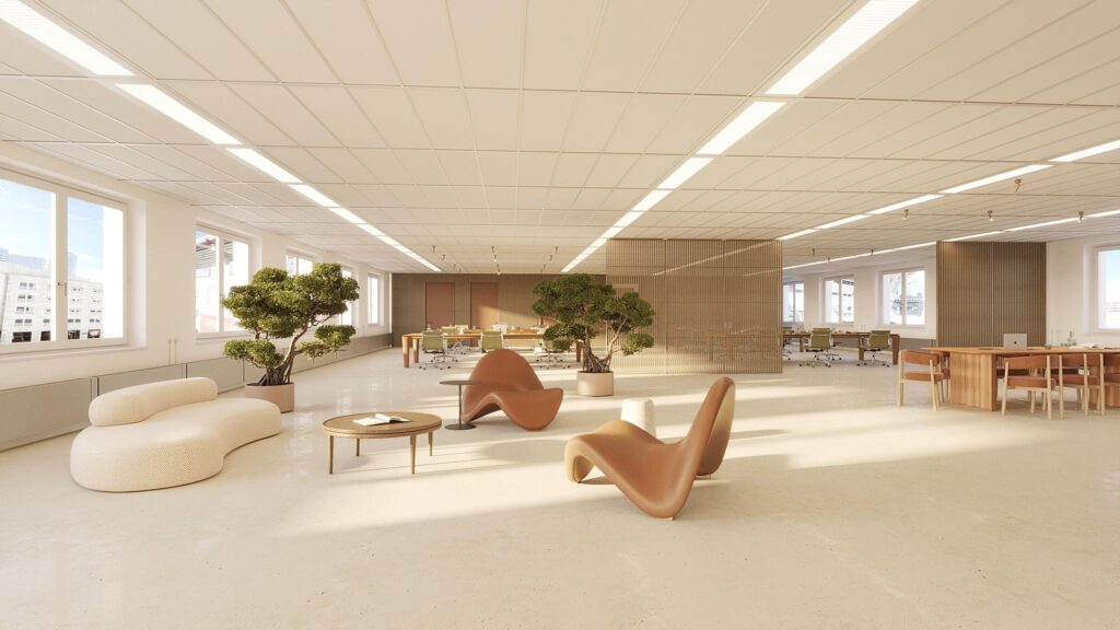 Moderne, lichtovergoten kantoorruimte aan de Johan Cruijff Boulevard met designmeubilair, planten en werkplekken.